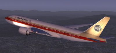 Continental Airlines Boeing 777-200 flying at night.