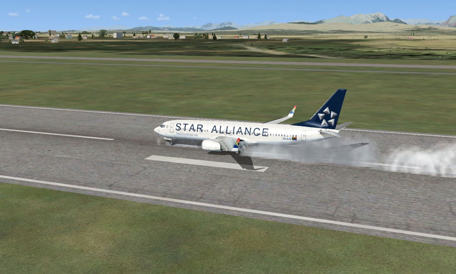 Star Alliance Boeing 737-800 landing on runway.