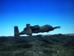 A-10 Warthog flying over mountains