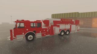A red U.S. Air Force fire truck with an extended ladder is parked on a wet tarmac near a brick building.