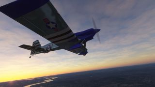 A blue-and-silver propeller aircraft with striped wings and a checkered tail flies above a winding river beneath an orange horizon.