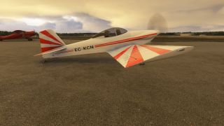 A white low-wing aircraft with red sunburst markings and registration EC-KCN sits on the apron, with a red biplane behind it.