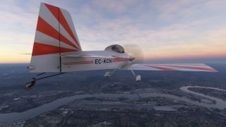 A red-and-white propeller aircraft marked EC-KCN flies above a winding river and urban airport beneath a pastel sky.