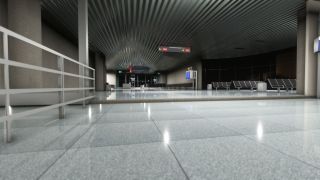 An empty airport concourse has rows of black seats, reflective tiled flooring, and overhead signs directing passengers to gates D98 and D99.