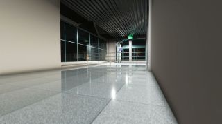 An empty terminal corridor has reflective tiled flooring, large dark windows, metal railings, and an illuminated green exit sign.