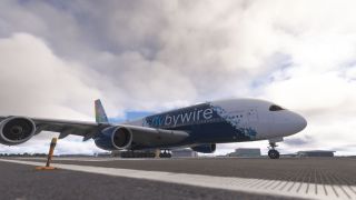 A blue-and-white Airbus A380 rests on airport pavement, with landing gear extended, hangars behind it, and thick clouds overhead.