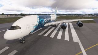 An Airbus A380 in blue and white livery sits across runway threshold markings, with landing gear extended beneath cloudy skies.