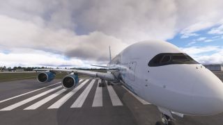 A white double-deck airliner sits over runway threshold markings, with blue engine nacelles and extended landing gear beneath cloudy skies.