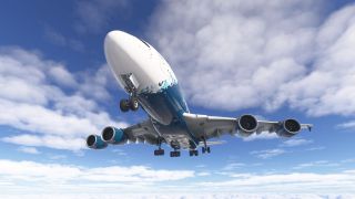 A blue-and-white Airbus A380 flies overhead with landing gear extended, its four engines visible against a partly cloudy sky.
