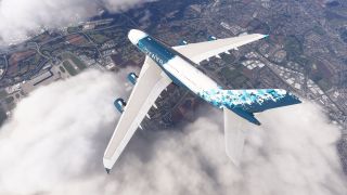 A four-engine Airbus A380 in blue-and-white livery flies above scattered clouds, with an airport and dense urban development below.