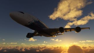 A four-engine airliner flies above scattered clouds with landing gear retracted, viewed from below against a low sun and golden sky.