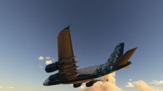 A four-engine, double-deck airliner banks above sunlit clouds, revealing its underside and teal geometric patterns across the fuselage and tail.