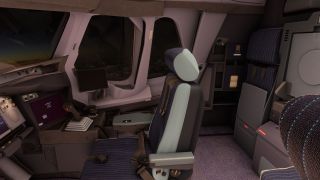 The cockpit contains an empty pilot seat with harness straps, a side-stick controller, dark displays, and a folded rear jump seat.