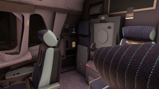 The rear cockpit area contains striped crew seats with shoulder harnesses, gray storage compartments, and side windows overlooking darkness.