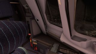 The cockpit sidewall features large windows overlooking city lights at night, beside a striped seat and a red fire extinguisher.