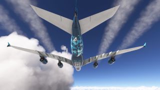 A four-engine Airbus A380 flies overhead, showing its blue patterned underside, swept wings, and trailing contrails against scattered clouds.
