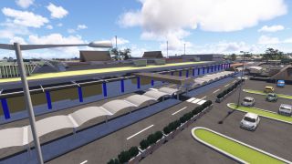 An airport terminal with blue columns faces covered pedestrian walkways, marked access roads, and a parking area with scattered cars.