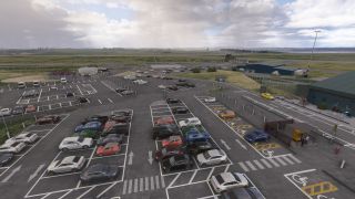 An airport car park contains rows of vehicles, accessible spaces, and pedestrian crossings, with terminal buildings and runways beyond.