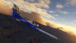 A blue and white aircraft with a checkered tail banks above rugged canyon terrain beneath golden clouds.