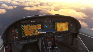 The cockpit features two digital flight displays, analog gauges, and a flaps interaction prompt, with golden clouds above mountainous terrain outside.