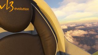 A black cockpit seat with yellow VL3 evolution lettering sits beside a curved canopy overlooking scattered clouds and rugged canyon terrain.