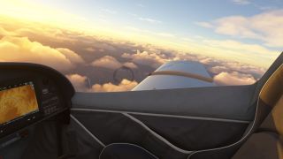 The cockpit view shows a terrain display, an empty passenger seat, and the right wing above golden clouds and rugged terrain.