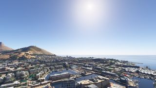 A coastal city surrounds marina basins, with hillside neighborhoods, an oval stadium, and a waterfront Ferris wheel beneath clear skies.