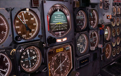 Close-up of the flight deck showing attitude indicator and other dials