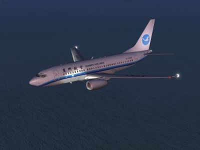 China Xiamen Airlines Boeing 737-700 flying at night.