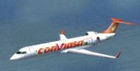Conviasa Bombardier CRJ-700 flying over water.