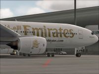 Emirates Boeing 777-21H on tarmac.