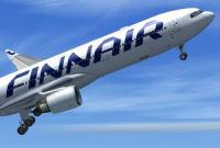 Finnair Airbus A330-300 with landing gear lowered.
