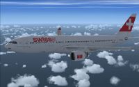Swiss Airbus A330-223 flying above water.