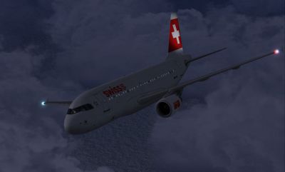 Swiss International Airbus A319-112 flying at night.