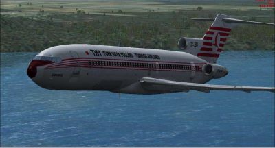 Turkish Airlines Boeing 727-2F2 flying over water.