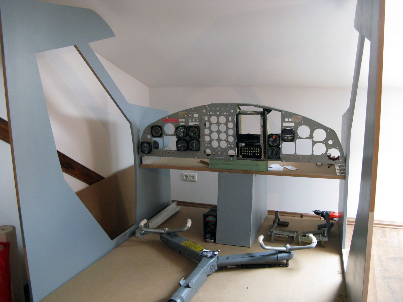 The shell of the Twin otter II cockpit (including the original yoke).