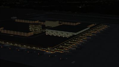 Aerial view of Berlin Brandenburg Airport at night.