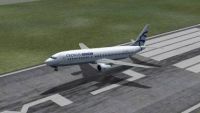 Aegean-Cronus Airlines Iniochos Boeing 737-400 taking off from runway.