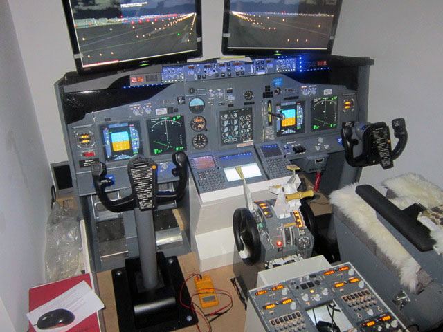 Fabio's cockpit with colorful glass display and two screens.