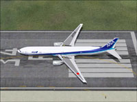 Top down view of ANA Boeing 777-381 on runway.