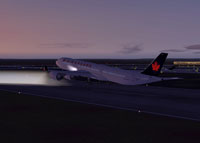 Air Canada Airbus taking off from runway at night.