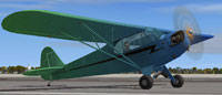 Screenshot of green and blue Piper Cub on runway.