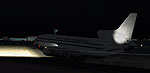 Screenshot of jetliner on a dark runway at night.