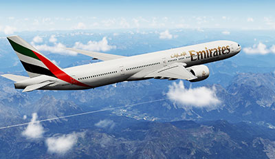 Screenshot shows an Emirates 777-300ER flying over mountains after being installer in Prepar3D v5.