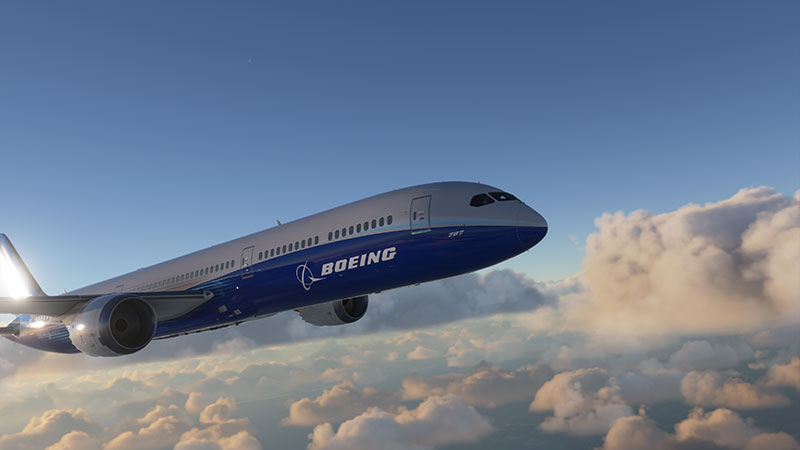 Boeing 787 stock aircraft in flight over clouds.