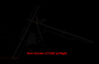 Overview of Gander International at night.