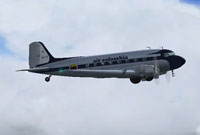 Profile view of Air Colombia Douglas DC-3 in the air.