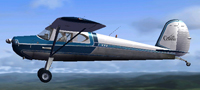 Side view of Blue Cessna 140 in the air.