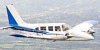 Image of Carmonair Piper Seneca II in flight.