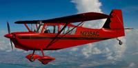Screenshot of red Citabria N235AC in flight.